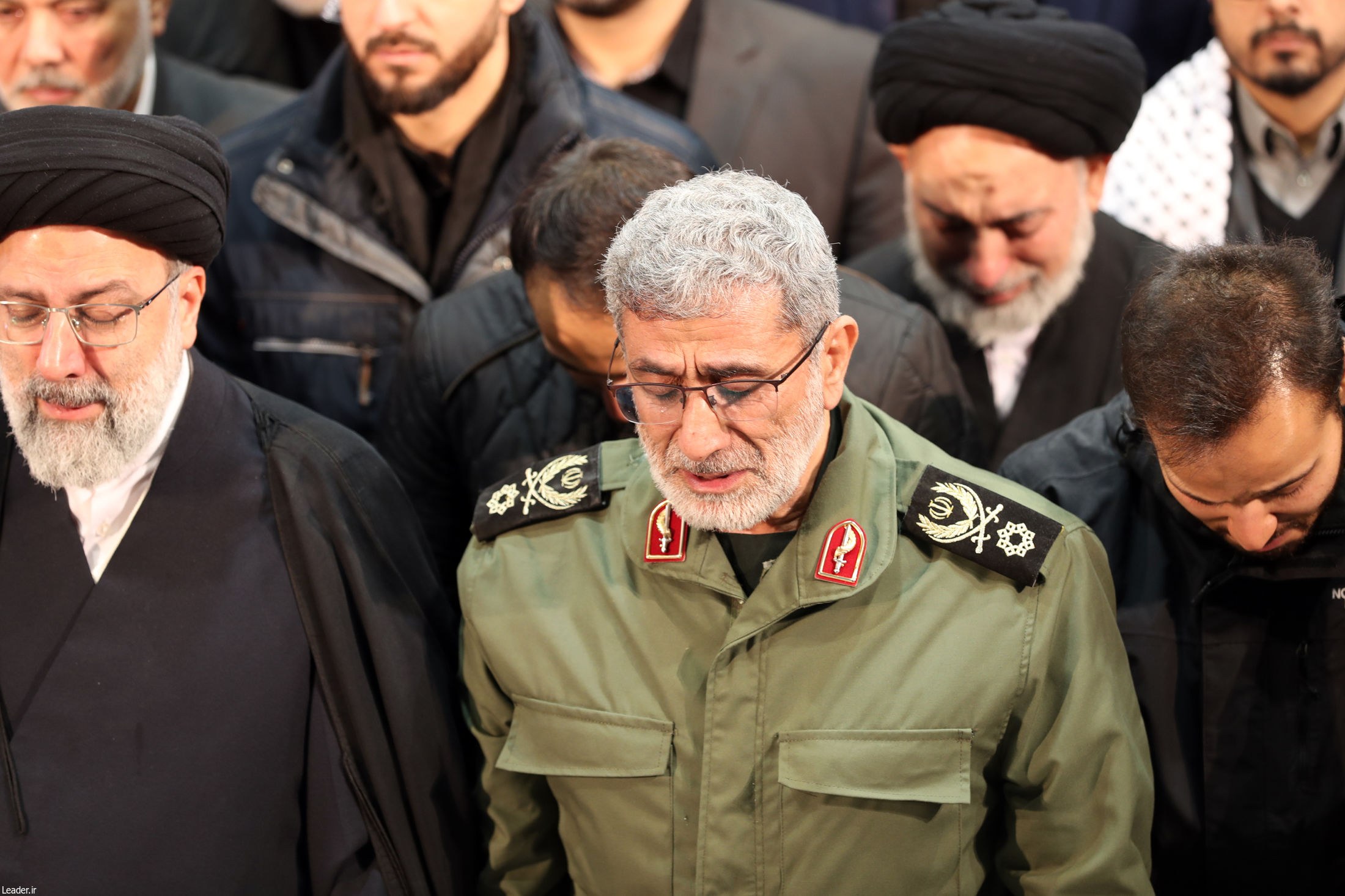 Esmail Qaani (C), weeping over the coffin his predecessor Qasem Soleimani during his funeral ceremony in Tehran (AFP)