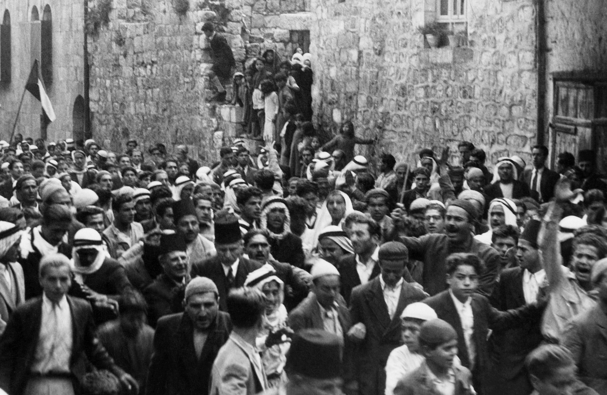 A picture dated before 1937 during the British Mandate in Palestine shows Arabs demonstrating in the Old City of Jerusalem against the Jewish immigration to Palestine.