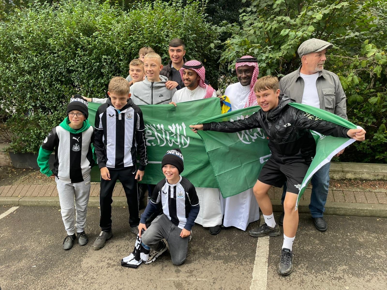 saudi flag newcastle young fans 