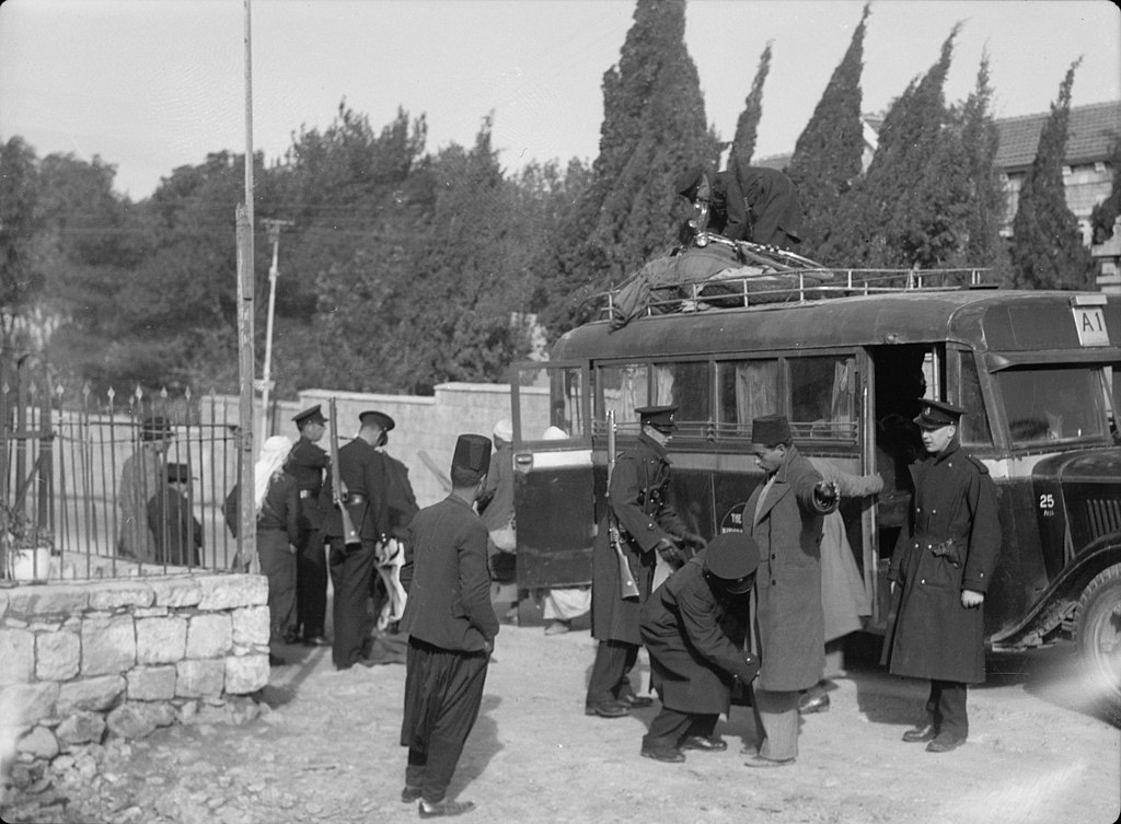 A Palestinian bus is stopped and searched for weapons on the road between Jerusalem and Jaffa in 1938 (Library of Congress)