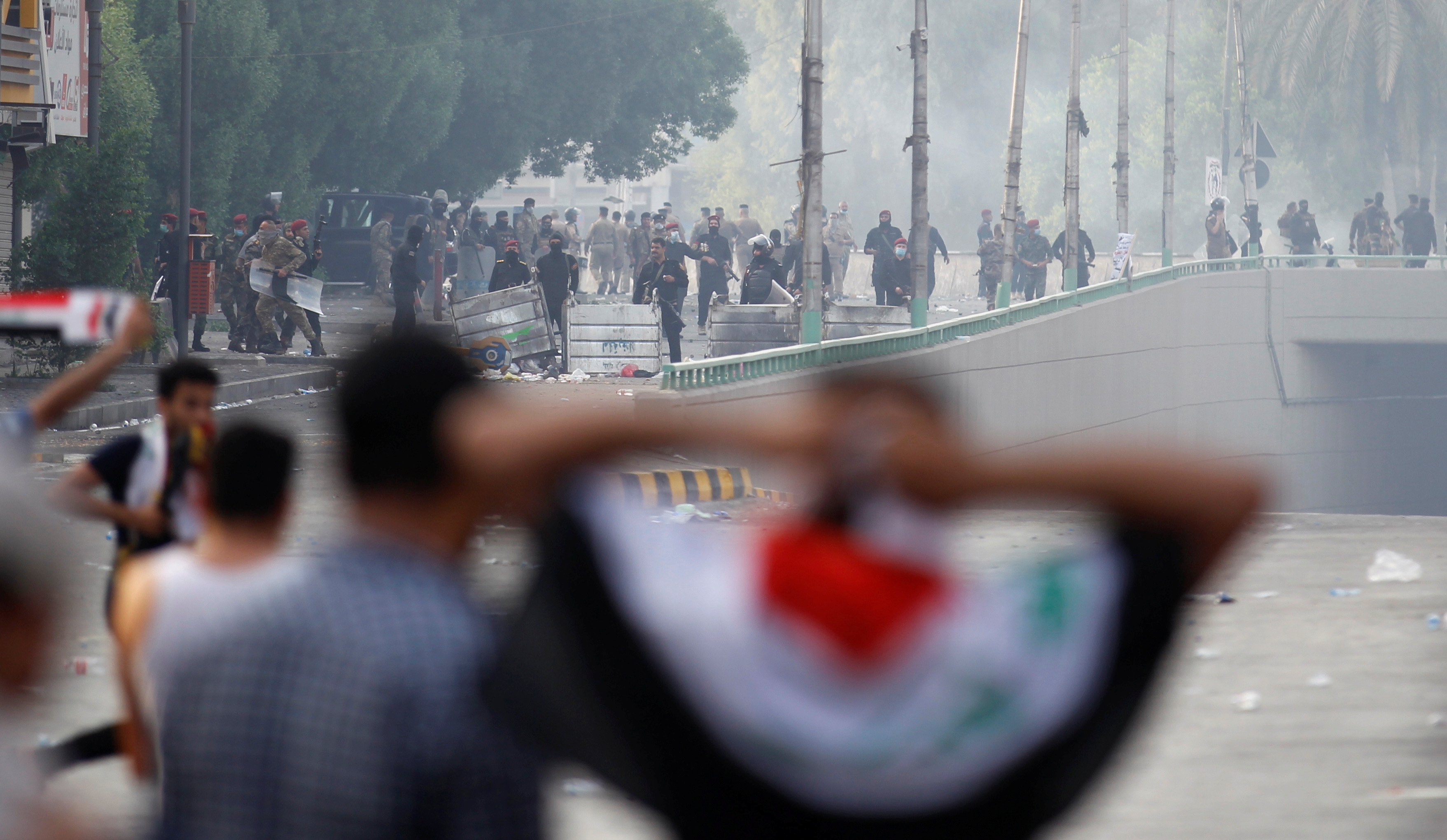  Demonstrators disperse as Iraqi Security forces use tear gas during a protest against government corruption amid dissatisfaction at lack of jobs and services at Tahrir square in Baghdad, Iraq October 1, 2019