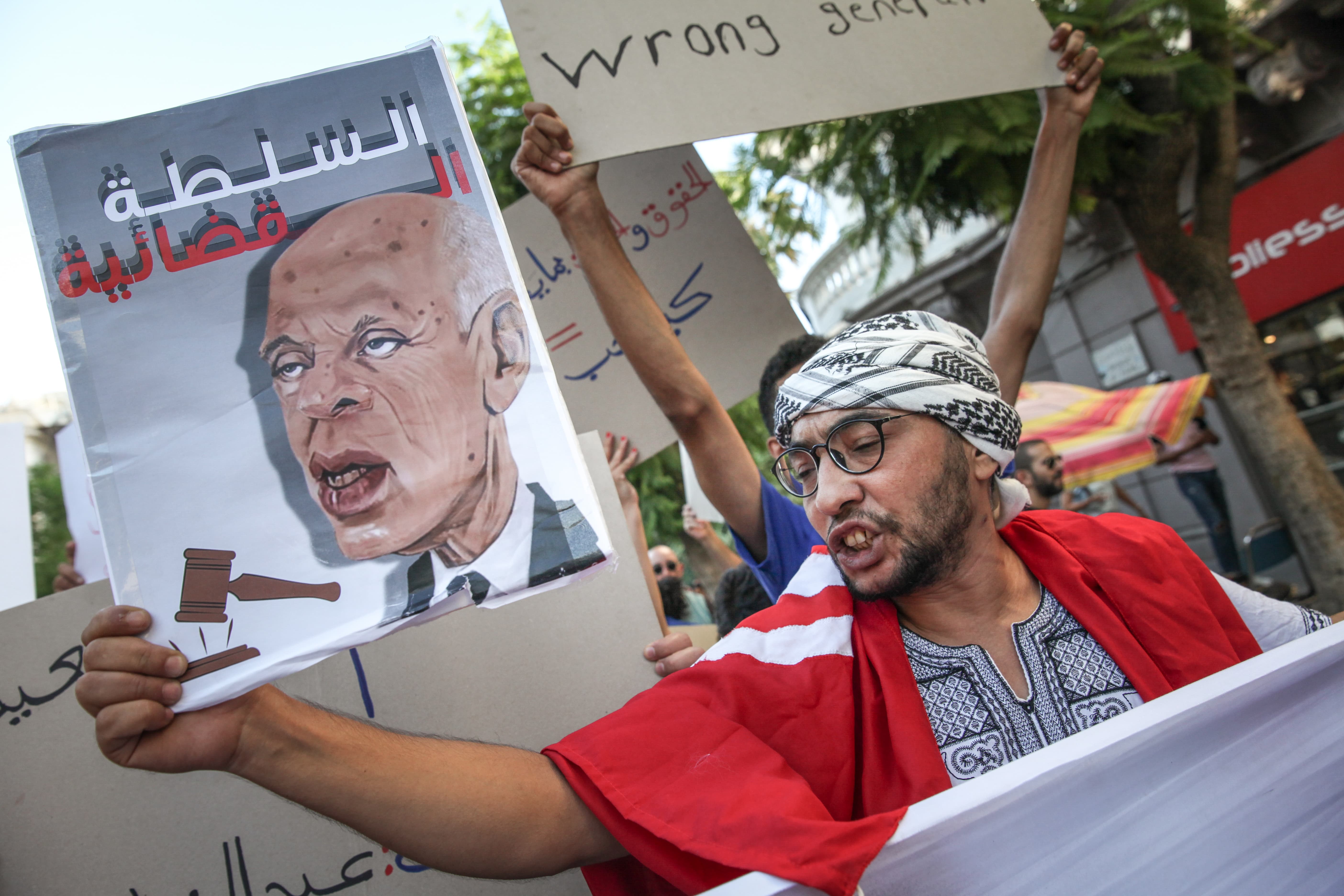 A Tunisian protester shouts slogans at an anti-protest in the capital Tunis, Tunisia, on 22 July 2022. (Reuters)