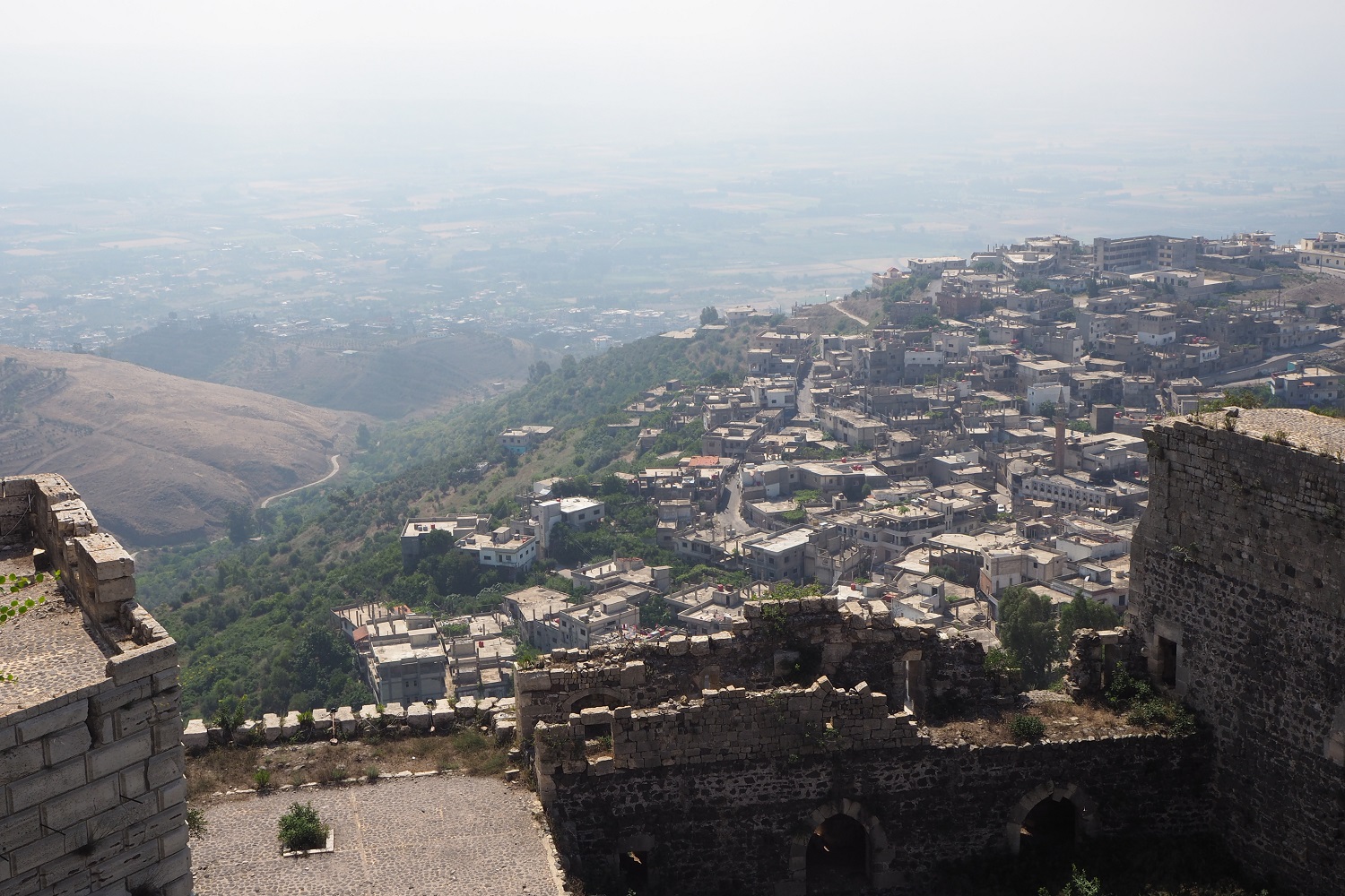 The view looking down on the small town of Al-Husan, where many of the castle workers live (Tom Westcott/MEE)