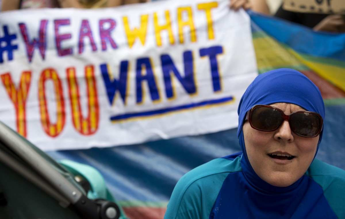 A woman wearing a "Burkini" joins a protest outside the French Embassy in London on August 25, 2016, during a "Wear what you want beach party" (AFP)