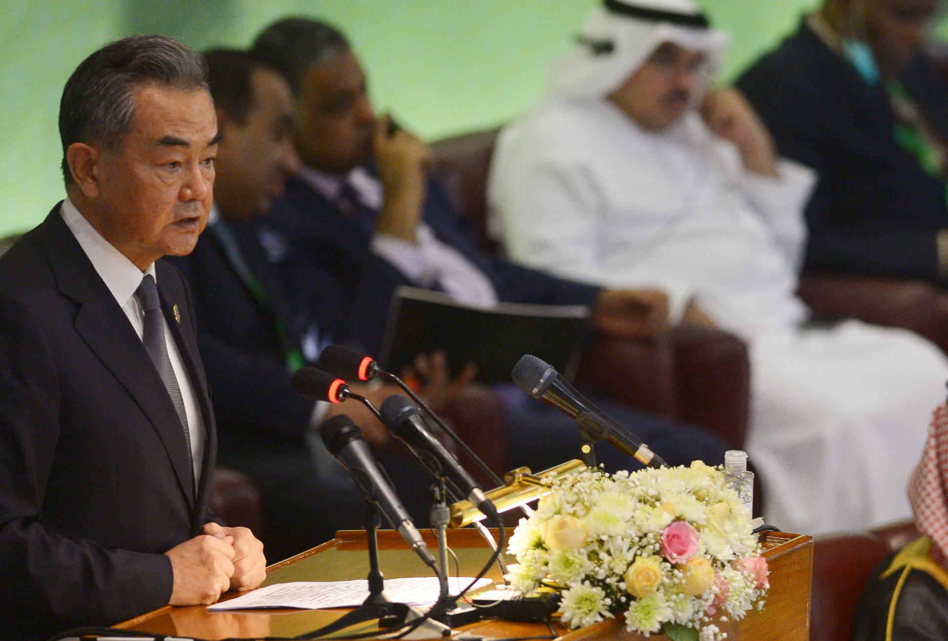 Chinese Foreign Minister Wang Yi addresses the OIC conference in Islamabad on 22 March 2022 (AFP)