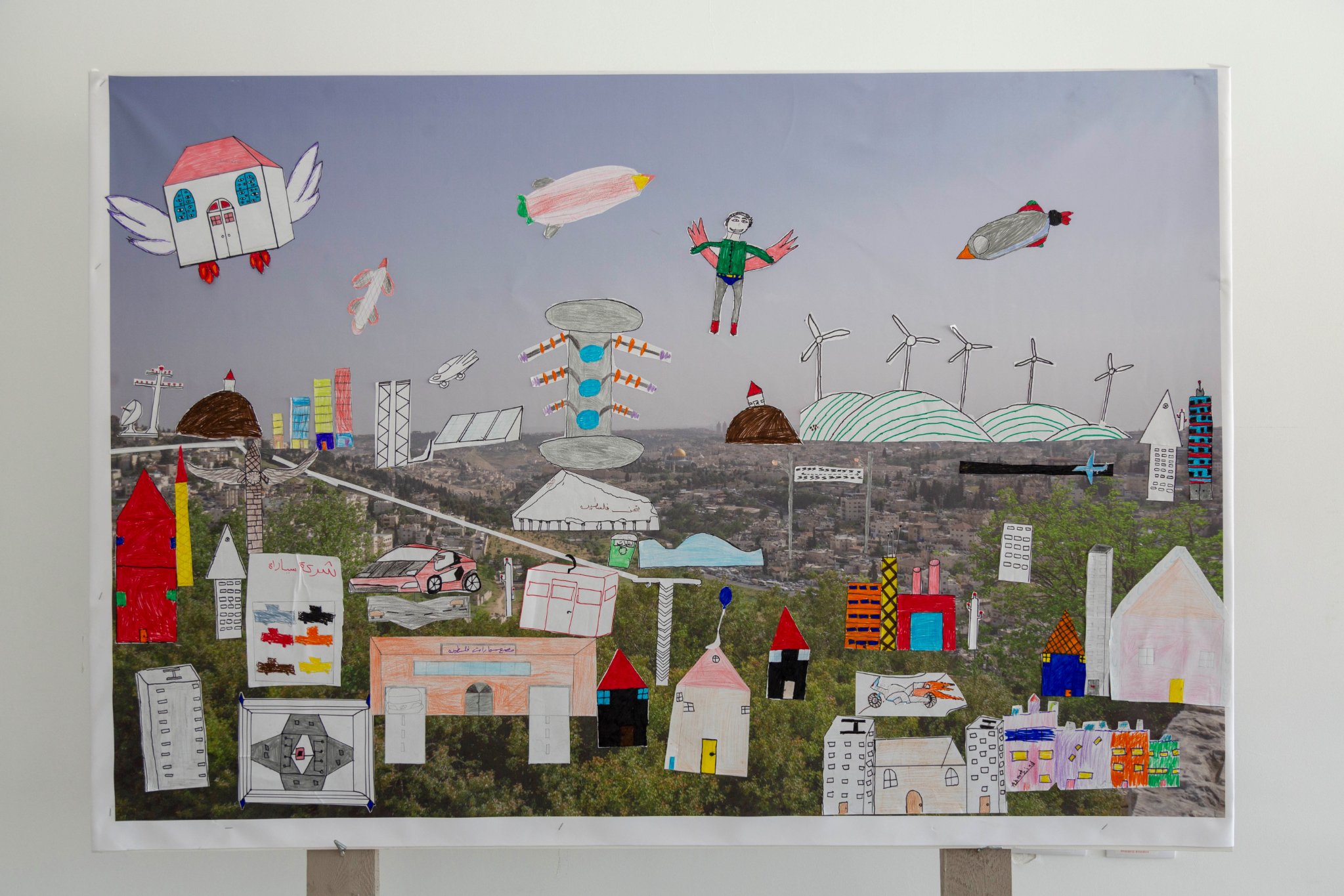 Photo Caption: “These are some of the artworks created by children who participated in a summer camp workshop organised by the Palestinian Museum Education Programme as part of the 2019 Intimate Terrains exhibition. Photo by Hareth Yousef. ©️The Palestinian Museum.”