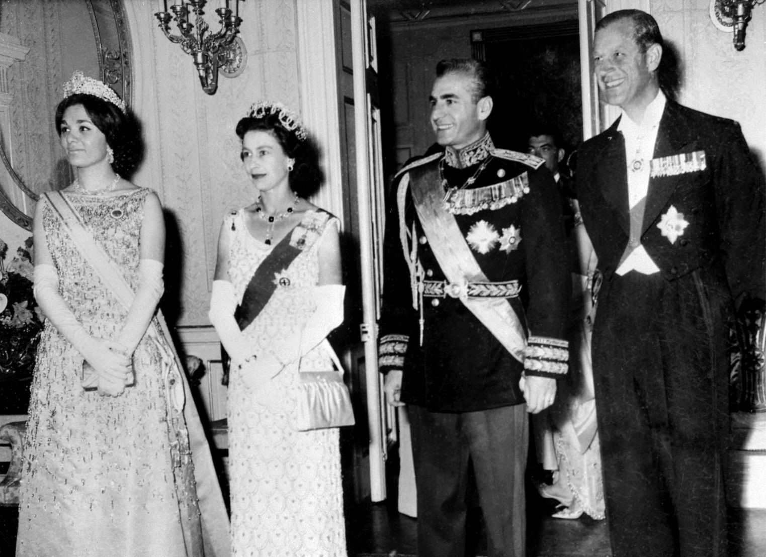 Queen Elizabeth II and the Prince Philip pose with Iran's Shah Mohammad Reza Pahlavi and his wife Farah Pahlavi during their state visit, March 1961 in Tehran (AFP)