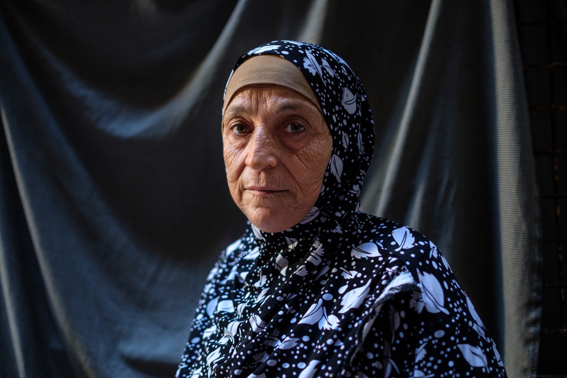 Wafaa Ali Afif, 68, outside her home in Shatila refugee camp. Wafaa got married in Shatila and raised a family of eight children (MEE/Rita Kabalan)