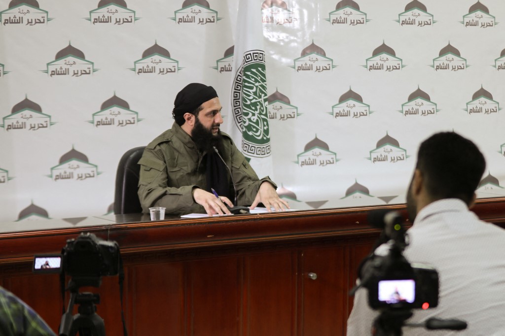 Jolani speaks at a news conference in Idlib, Syria, in 2019 (AFP/Hayat Tahrir al-Sham)