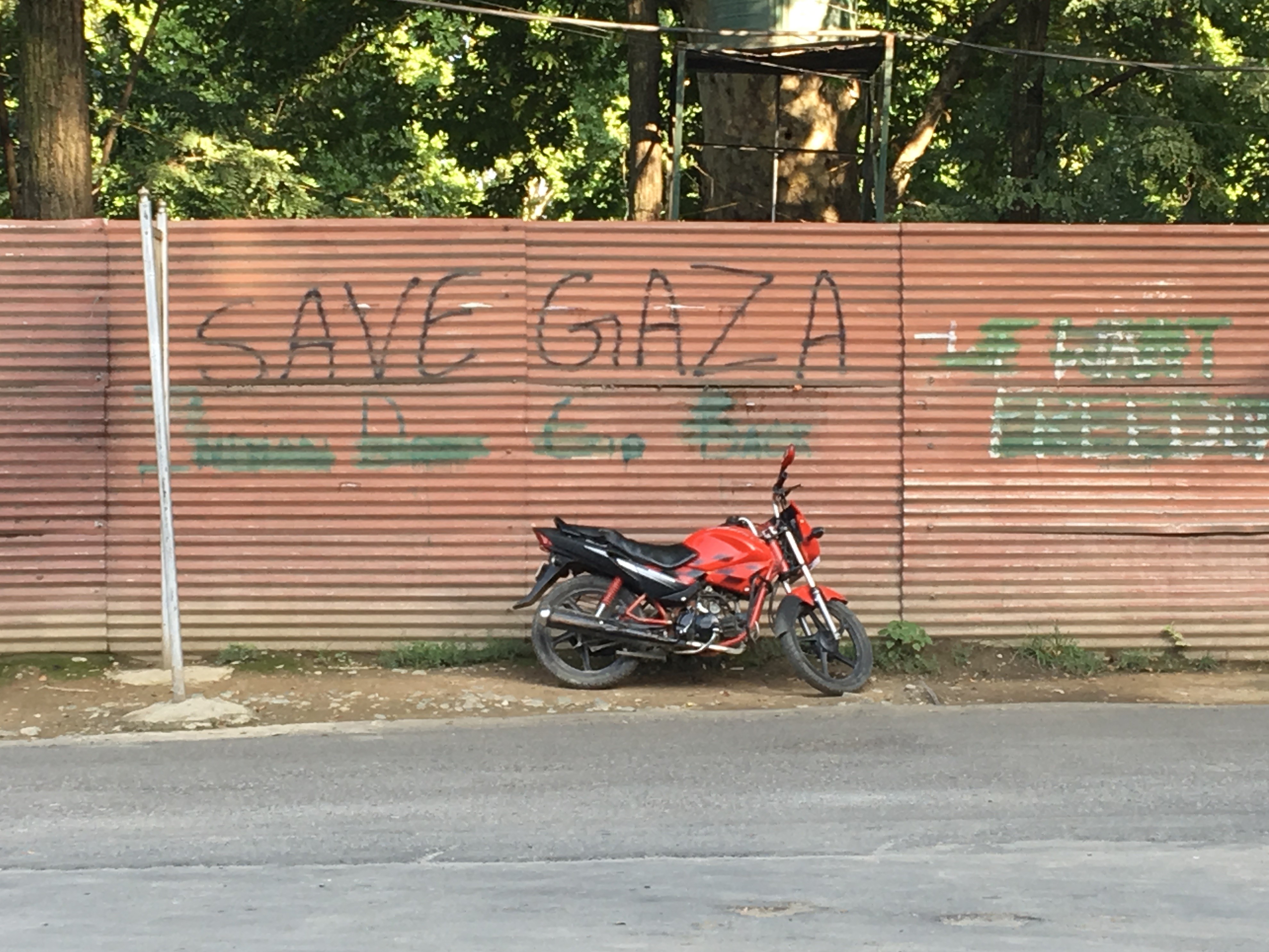 While the Indian state tries to remove all graffiti that references Kashmiri liberation from the walls and steel shutters, there is little attempt to remove the spray paint that spells "Free Gaza" (MEE)