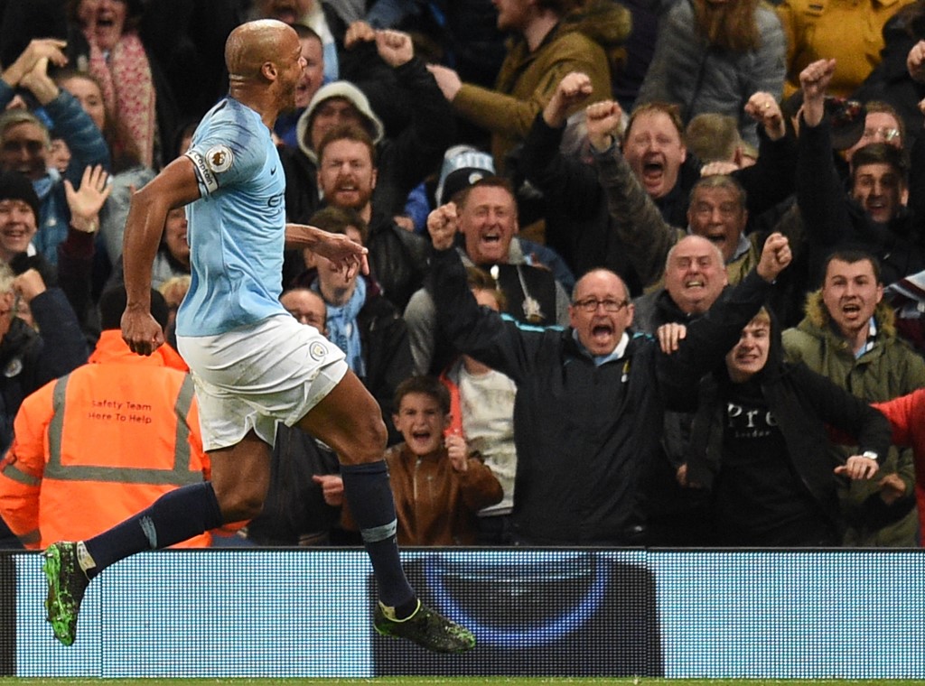 Manchester City's captain Vincent Kompany wheels away in delight after scoring the winning goal against Leicester City in the club's penultimate game of the Premier League season (Oli Scarff/AFP)
