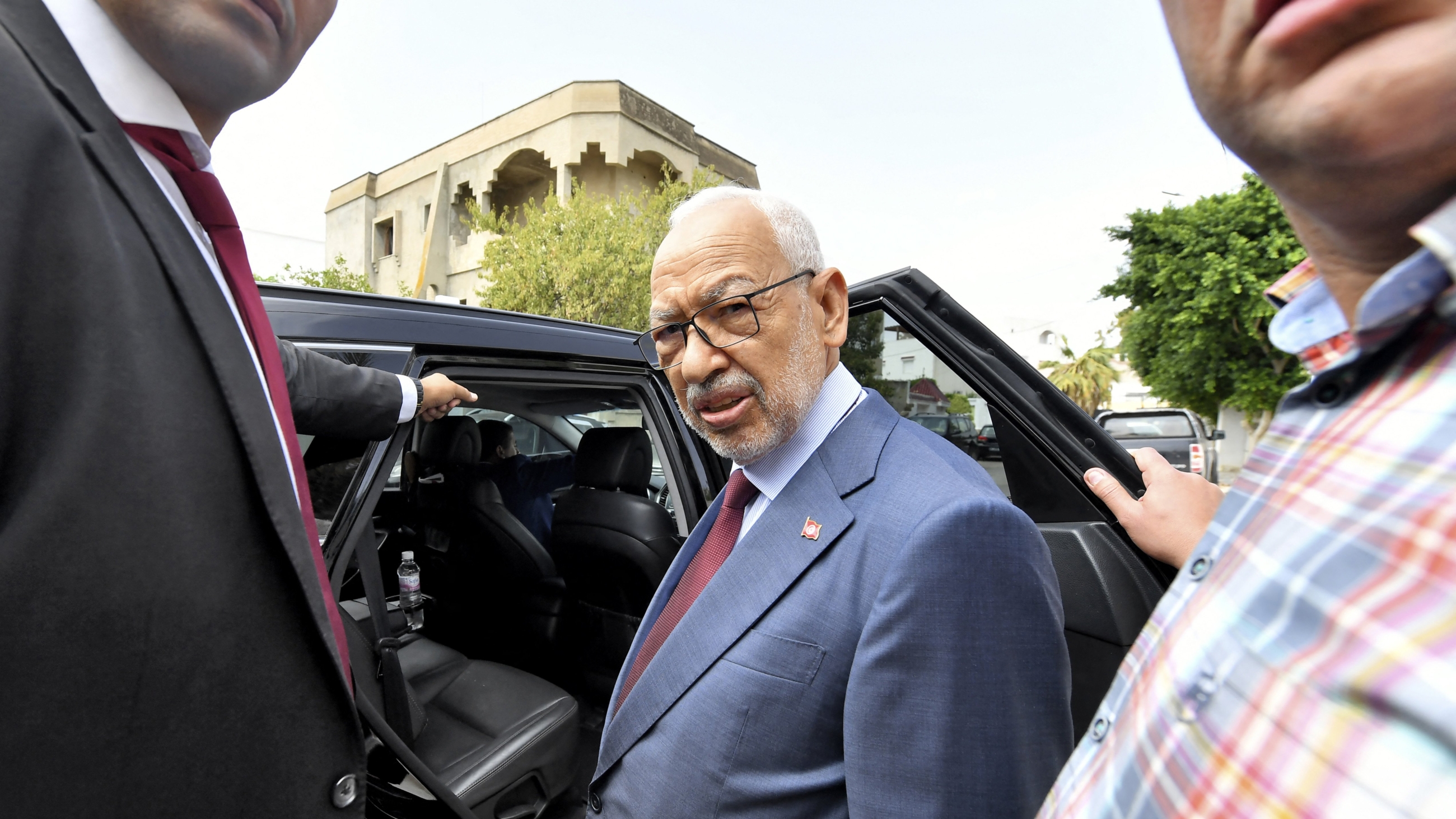 Rached Ghannouchi, leader of the Tunisian Ennahdha party, departs his house to go to the offices of Tunisia's counter-terrorism prosecutor in the capital Tunis on 20 September 2022 (AFP)