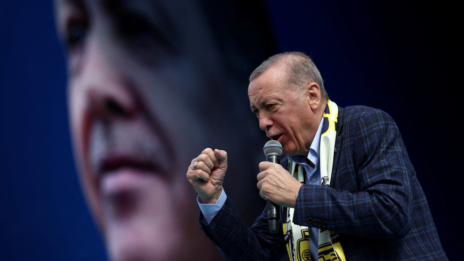 Turkish President Recep Tayyip Erdogan addresses his supporters during a rally ahead of the 14 May elections, in Ankara, 30 April (Reuters)