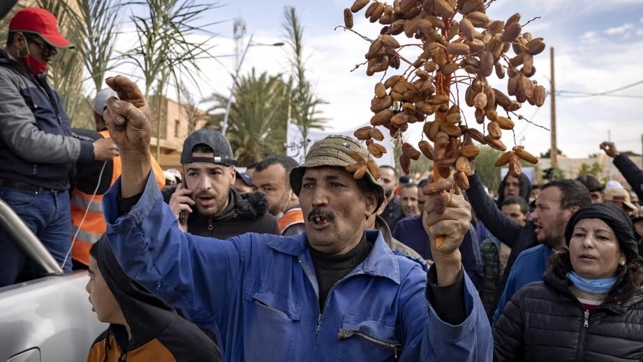 Moroccan farmers protest in the border city of Figuig on 18 March 2021 after Algerian authorities expelled the date growers from a border area (AFP)