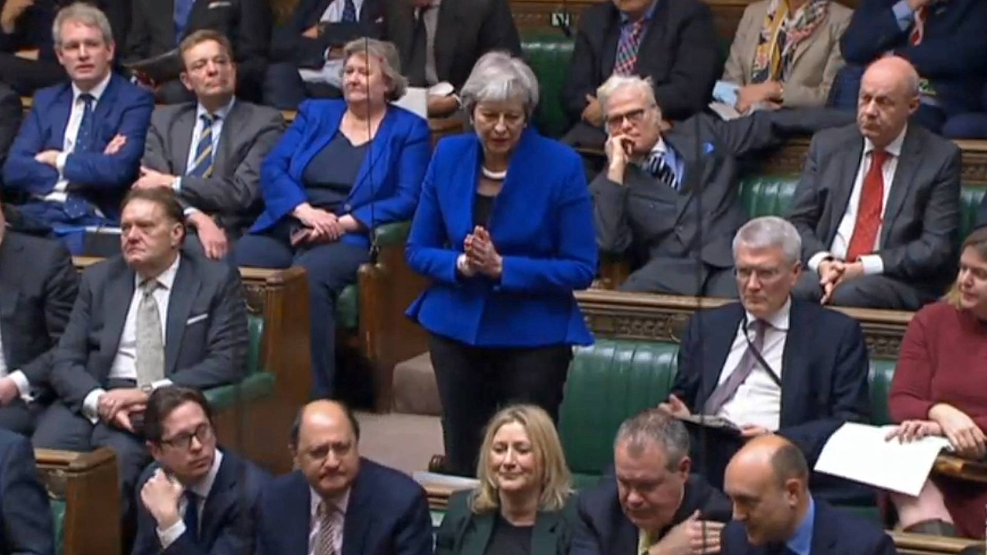  British former Prime Minister Theresa May asking a question of Boris Johnson, during his statement to MPs following the release of Sue Gray report on 31 January, 2022 (AFP)